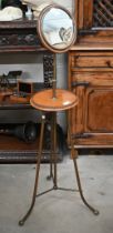 An antique mahogany and brass shaving/vanity stand with height adjustable circular mirror, makers
