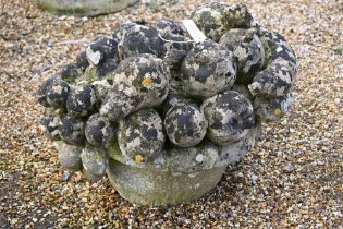 A weathered composite cast stone garden feature of a fruit bowl, a/f