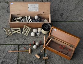 A boxed Army & Navy Co-Operative Society clock golf set to/w a carpet croquet set - also boxed (2)