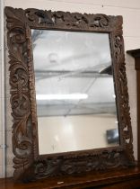 A foliate carved and pierced hardwood framed 'Florentine' mirror, 90 x 114 cm