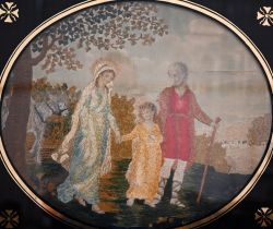 A 19th century silk longstitch picture of The Holy Family, 36 x 42 cm in black glass slip and gilt