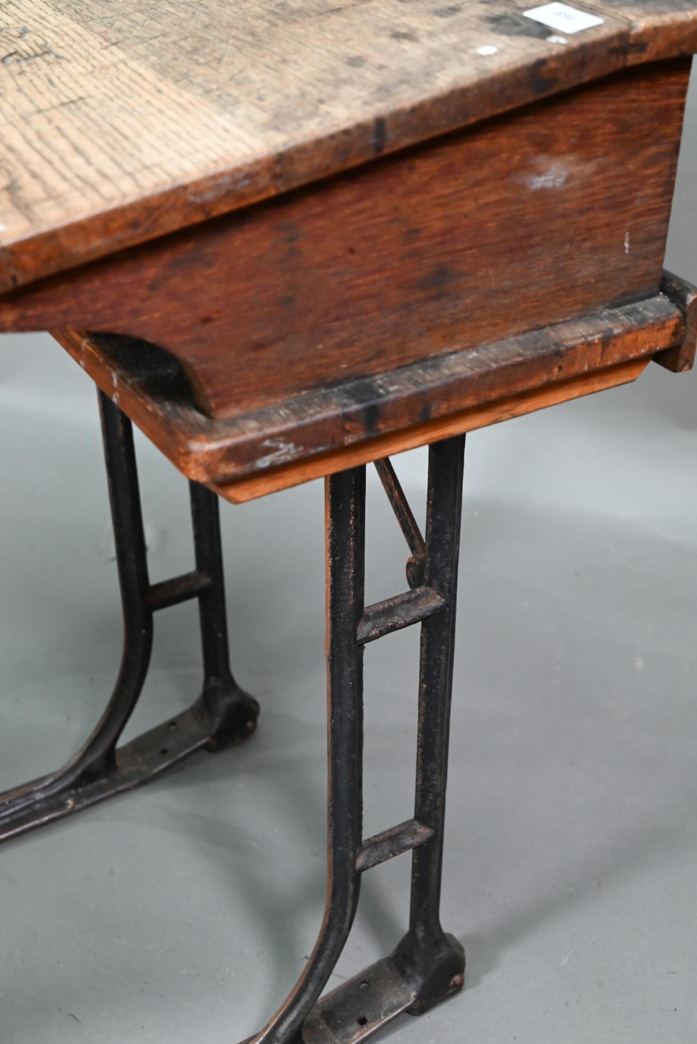 A Victorian cast iron and oak student/school desk, the slope top carved with multiple graffiti, - Image 7 of 7
