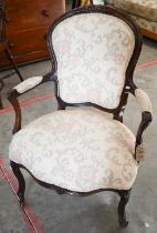A French Louis XV style fauteuil armchair with foliate upholstery