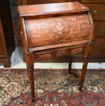 A Continental floral painted cylinder top desk on fluted supports, 66 cm wide x 40 cm deep x 100