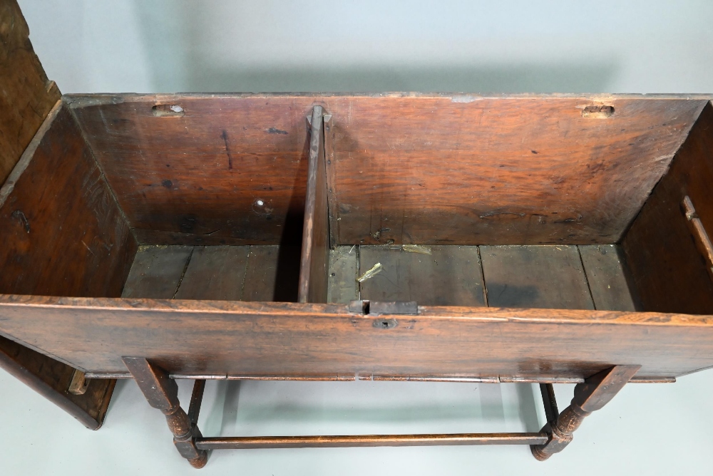 An antique oak dough bin, oak and walnut, the tapered body with single plank top, raised on part - Image 5 of 7