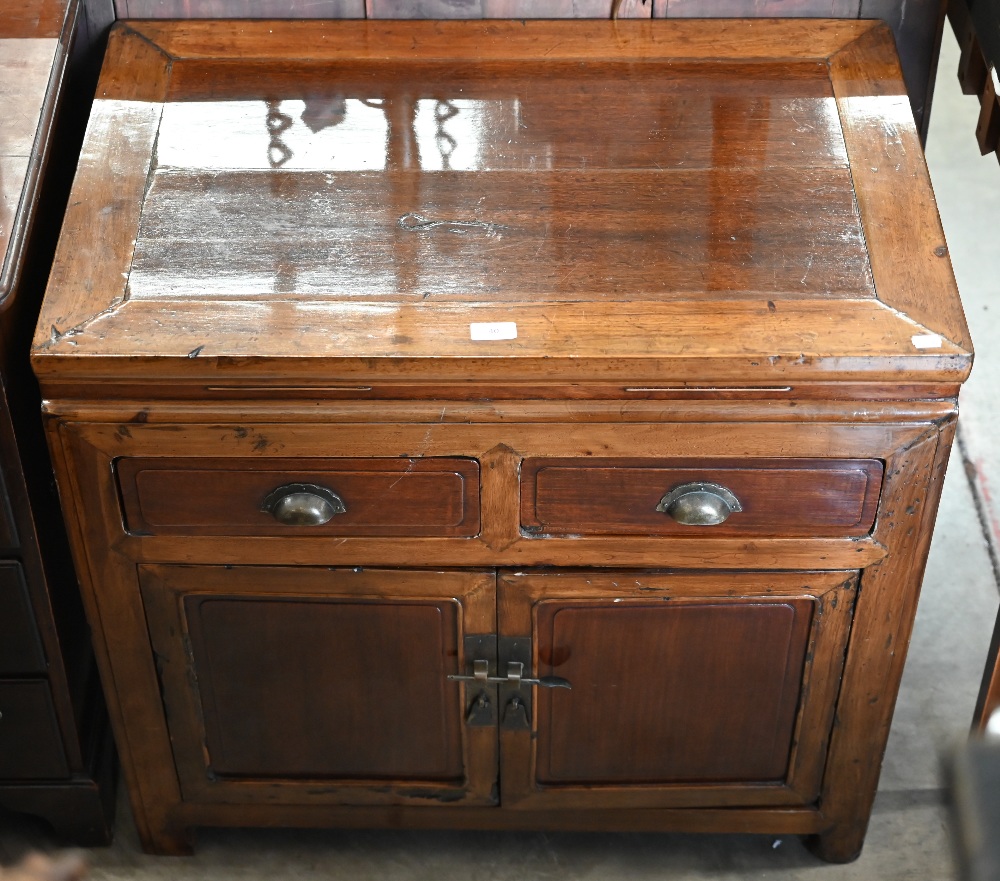 A Chinese stained and lacquered hardwood side cabinet with two drawers over panelled cupboards, 80 - Image 2 of 3