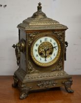 A 19th century French brass mantel clock with Japy Freres drum movement striking on a bell, 35 cm