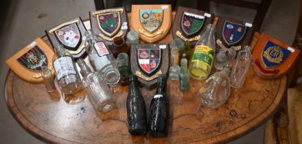 Various vintage and later glass bottles to/w eight modern Regimental shields (box)