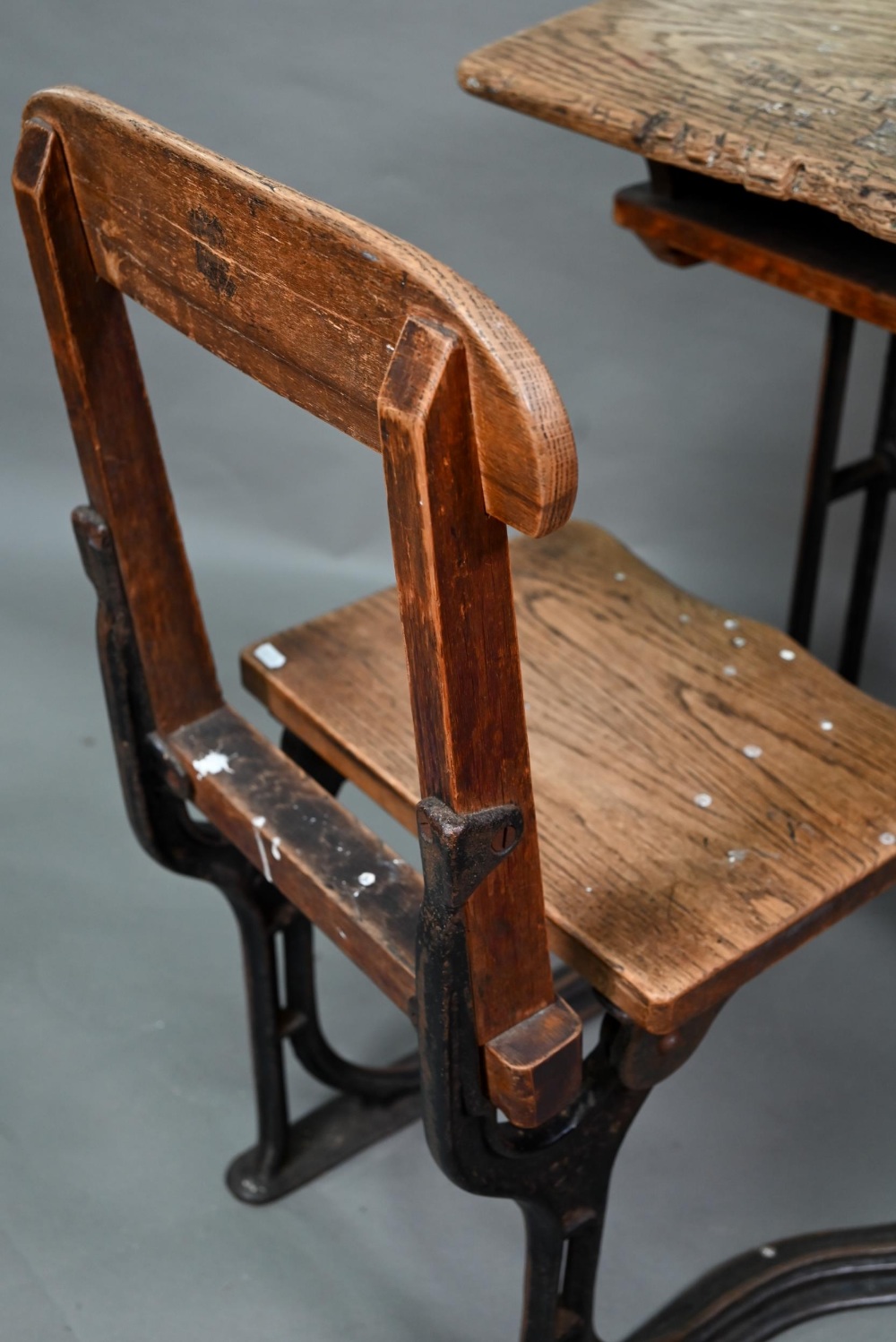 A Victorian cast iron and oak student/school desk, the slope top carved with multiple graffiti, - Image 6 of 6