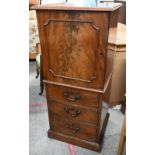 A 19th century mahogany drinks cabinet with panelled door over three drawers, 52 cm wide x 45 cm