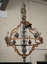 A rustic painted wood and brass six-sconce electrolier, weathered/aged finish