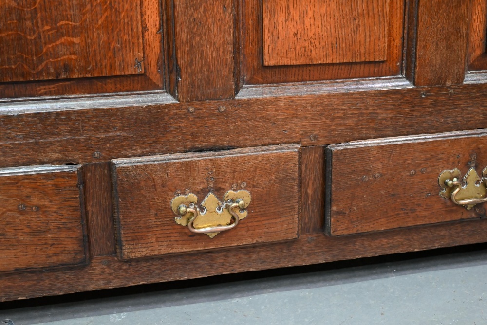 An 18th century oak mule chest, the three plank top over four fielded arched panels and three - Image 3 of 9