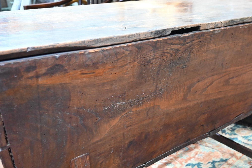 An antique oak dough bin, oak and walnut, the tapered body with single plank top, raised on part - Image 7 of 7