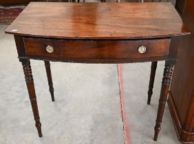 A mid 19th century mahogany bowfront hall table with single frieze drawer on turned supports, 92 x