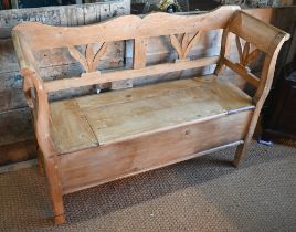 A Continental stropped pine box seated settle/hall bench, 127 cm w x 42 cm x 90 cm h