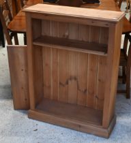 A modern pine low open bookcase, with two adjustable shelves, 76 cm w x 26 cm x 99 cm h