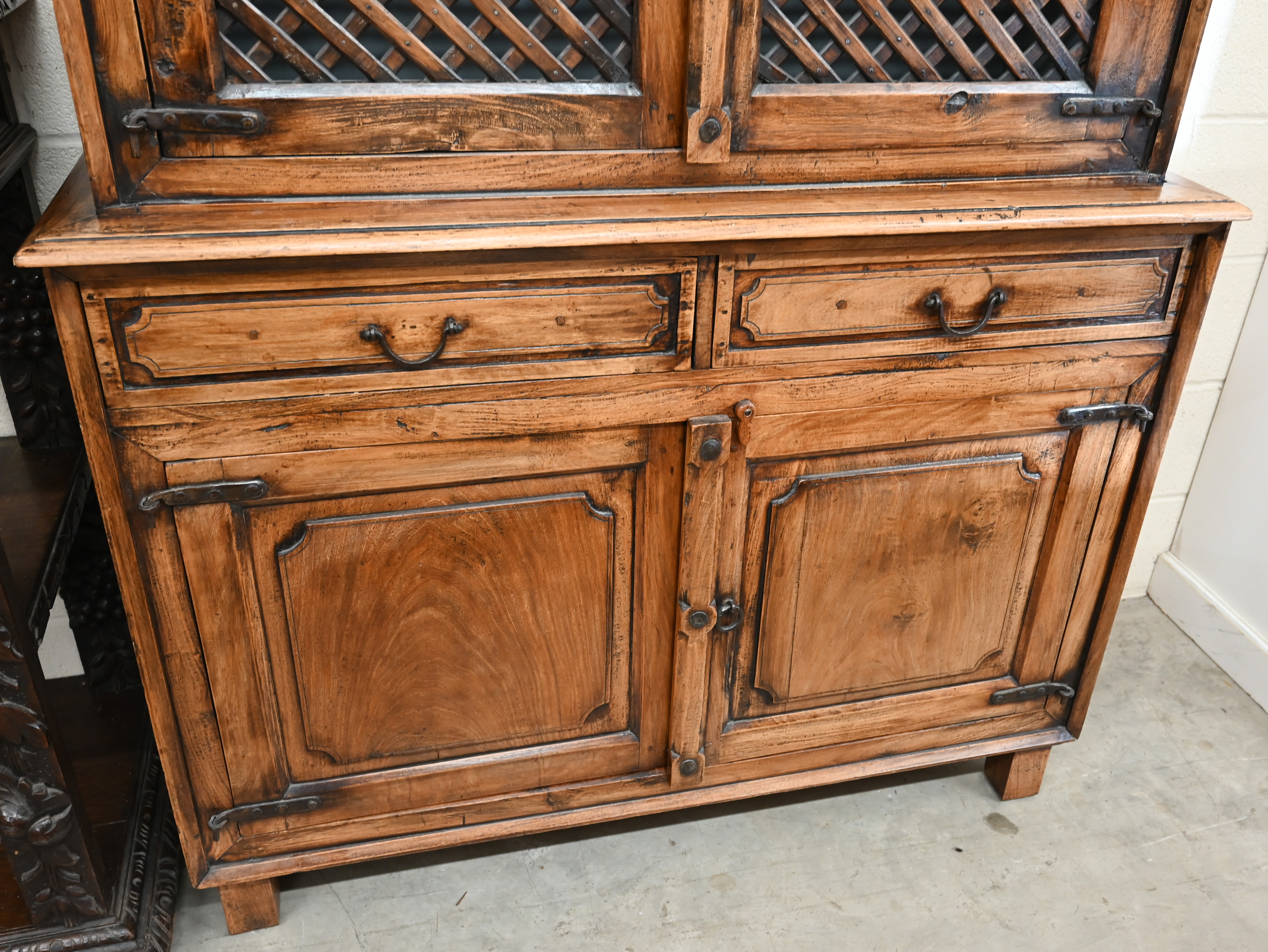 An Indian hardwood two part cabinet with open lattice panelled doors on base with two drawers and - Image 6 of 6