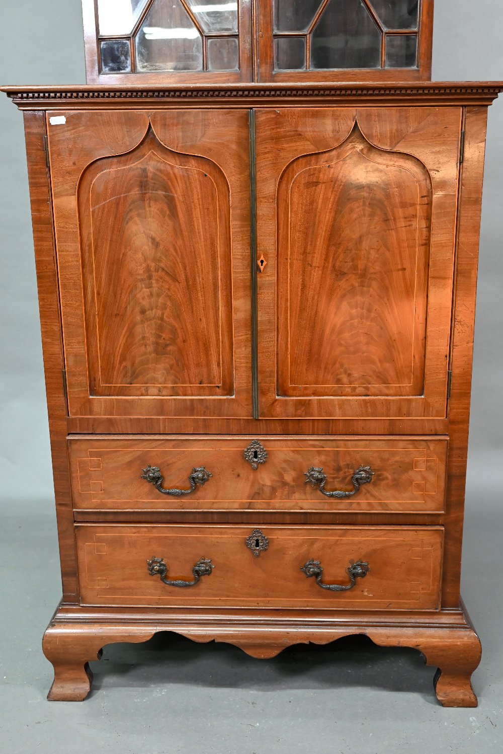 A Victorian mahogany cabinet with pair of Arabic arched panel doors over two long drawers, raised on - Image 2 of 8