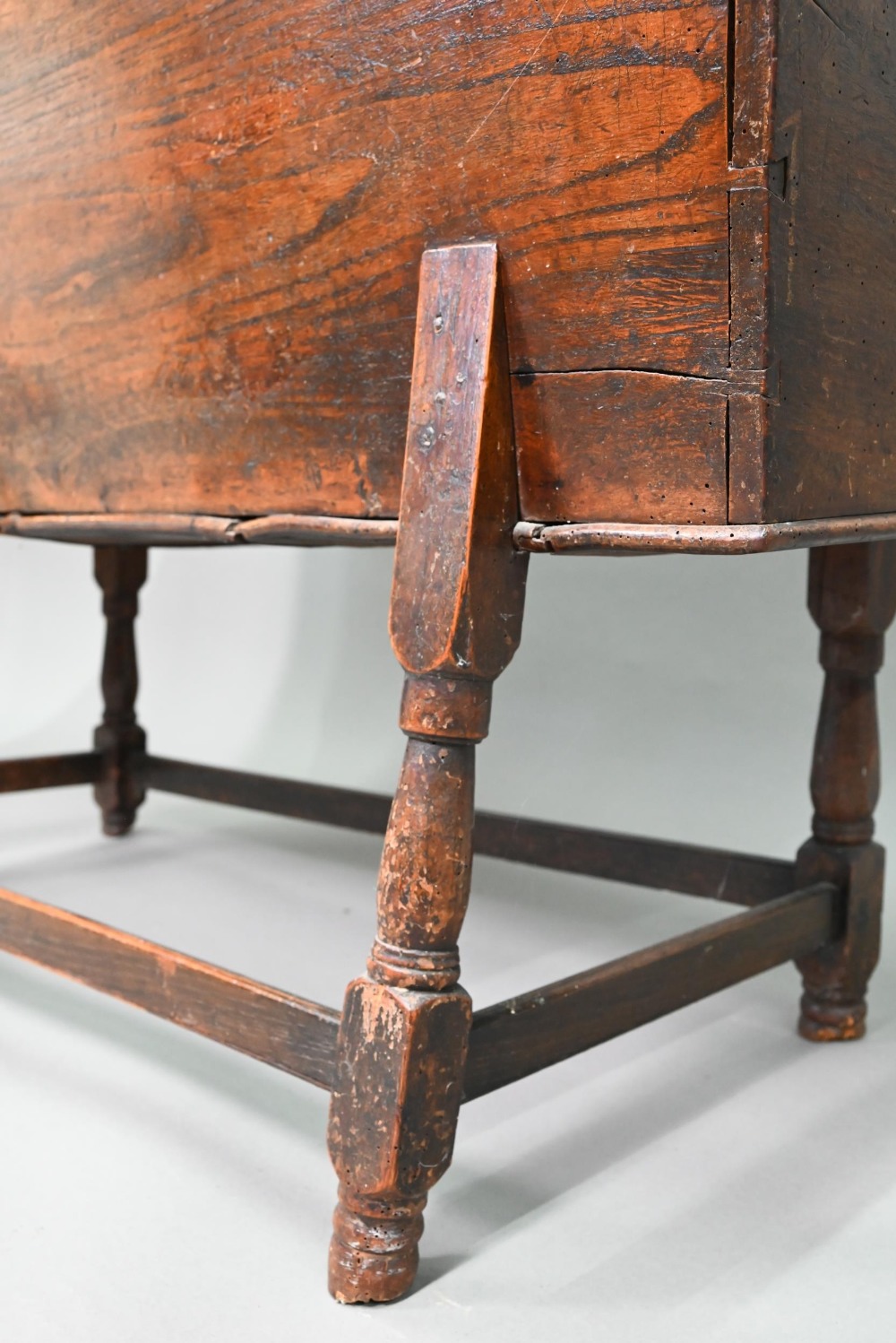 An antique oak dough bin, oak and walnut, the tapered body with single plank top, raised on part - Image 6 of 7
