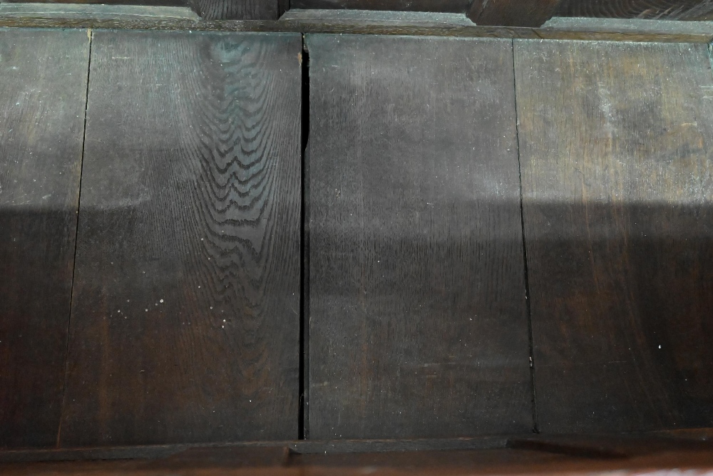 An 18th century oak mule chest, the three plank top over four fielded arched panels and three - Image 7 of 9