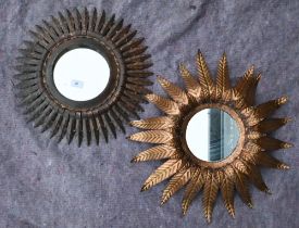 A vintage gilt metal 'sun burst' mirror, 42 cm diam (including frame), to/w a mirrored wall sconce