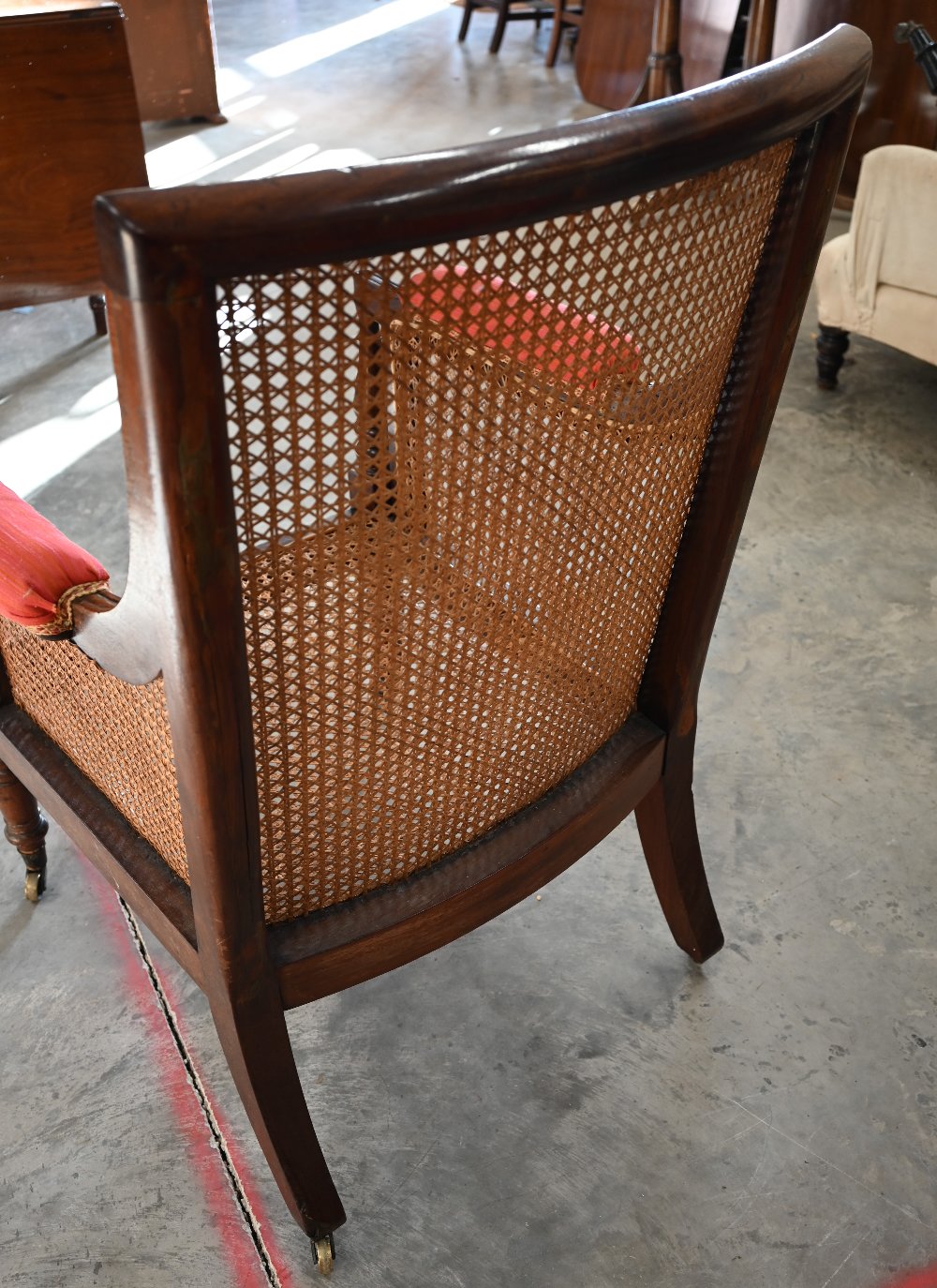 A mid 19th century mahogany framed bergere library chair with baluster turned supports and brass - Image 4 of 9