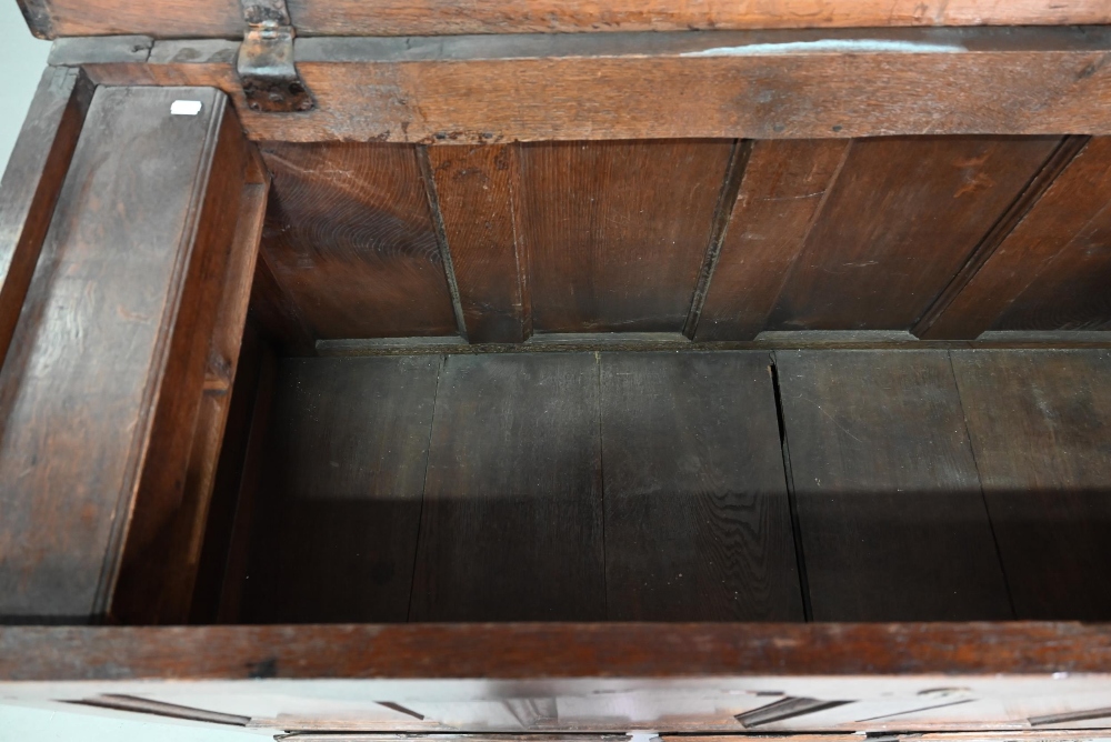 An 18th century oak mule chest, the three plank top over four fielded arched panels and three - Image 5 of 9