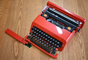 A 1960s red plastic Olivetti Valentine portable typewriter, designed by Ettore Sottsass & Perry