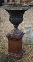 A large weathered classical cast urn on plinth, with patinated stoneware surface finish, on square