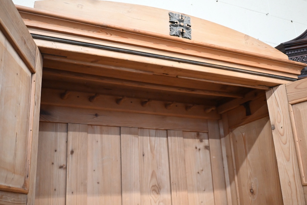 An antique pine knock-down wardrobe with twin panelled doors enclosing open hanging space on - Image 4 of 4