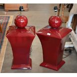A large pair of puce-glazed ceramics table lamps, 73 cm high overall