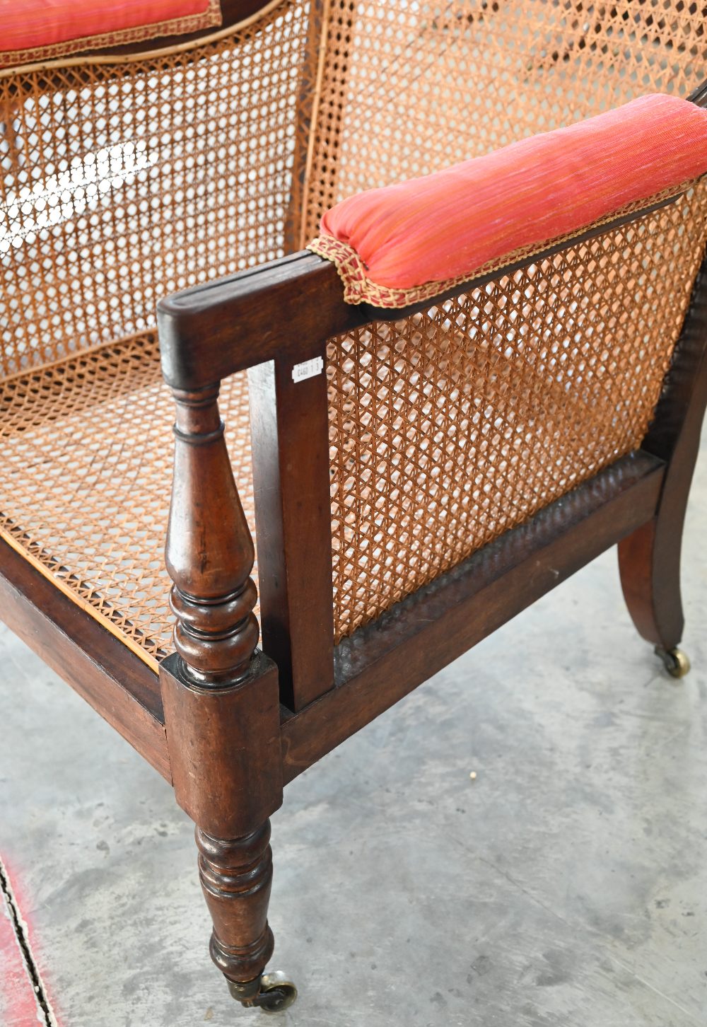 A mid 19th century mahogany framed bergere library chair with baluster turned supports and brass - Image 3 of 9