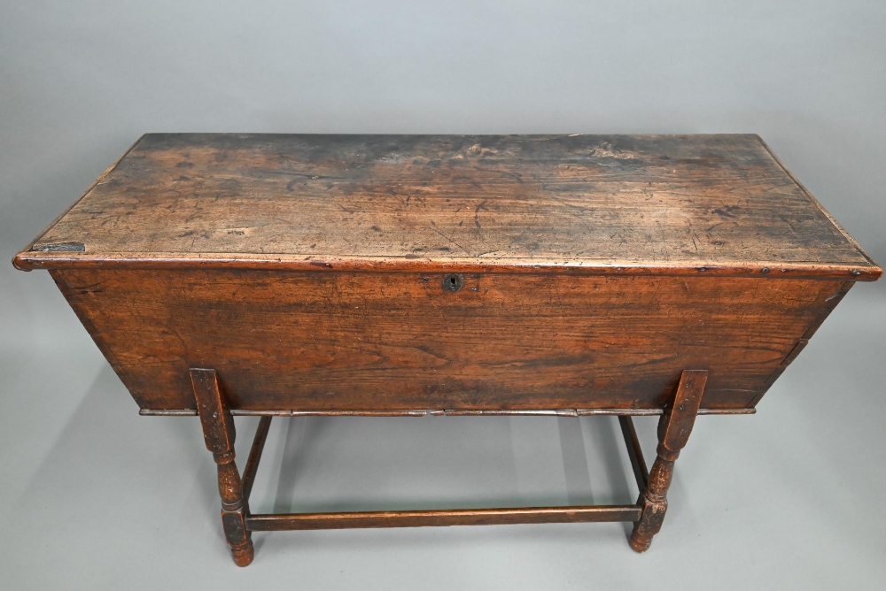 An antique oak dough bin, oak and walnut, the tapered body with single plank top, raised on part - Image 3 of 7