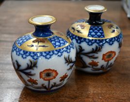 A near-matched pair of Edwardian Moorcroft MacIntyre Aurelian pattern small vases with Art Nouveau