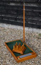 A vintage stained oak bar skittles game
