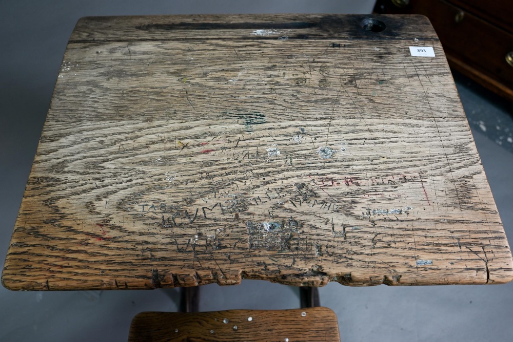 A Victorian cast iron and oak student/school desk, the slope top carved with multiple graffiti, - Image 4 of 6