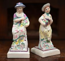 A pair of Georgian Pratt ware female figures 'Spring' and 'Autumn' from the 'Four Seasons' on square