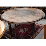 A 19th century mahogany circular campaign dining table on spiral turned supports