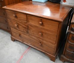 A 19th century mahogany low chest of two short over two long drawers with turned handles, raised