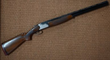 A Lanber (Spain) 12 bore over and under shotgun with engraved lock and walnut stock; 70cm