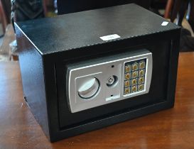 A small safe with digital combination lock (master key in office), 31 x 20 x 20 cm