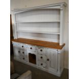 A substantial part-painted pine kitchen dresser with open plate rack with two shelves on base with