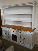 A substantial part-painted pine kitchen dresser with open plate rack with two shelves on base with