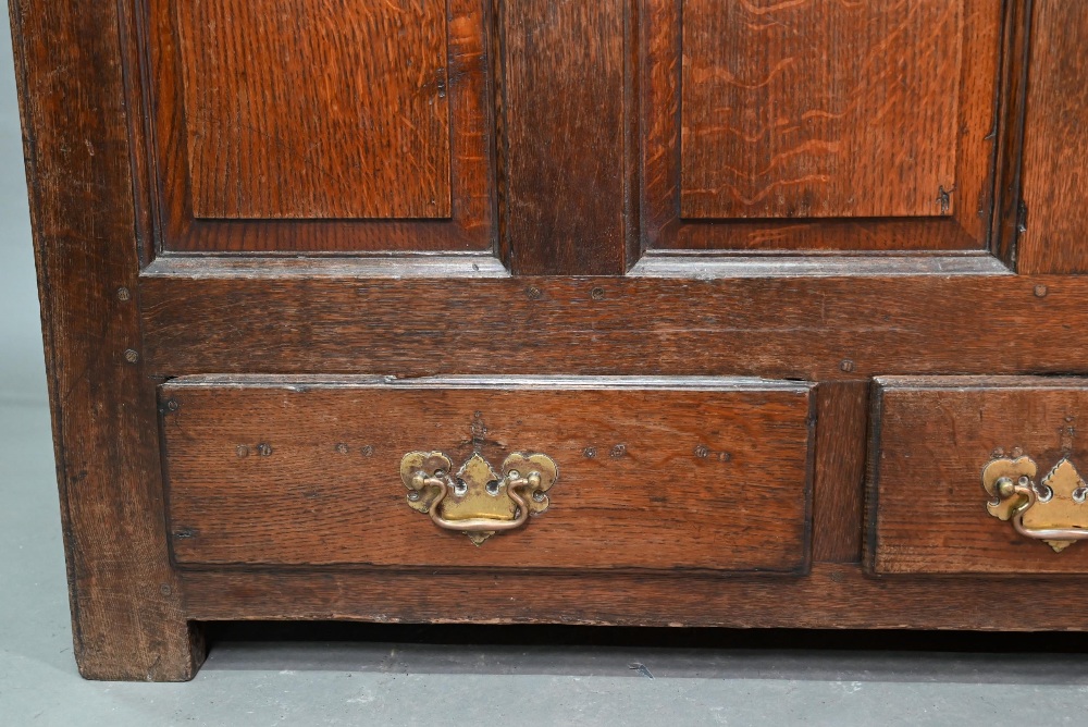 An 18th century oak mule chest, the three plank top over four fielded arched panels and three - Image 2 of 9