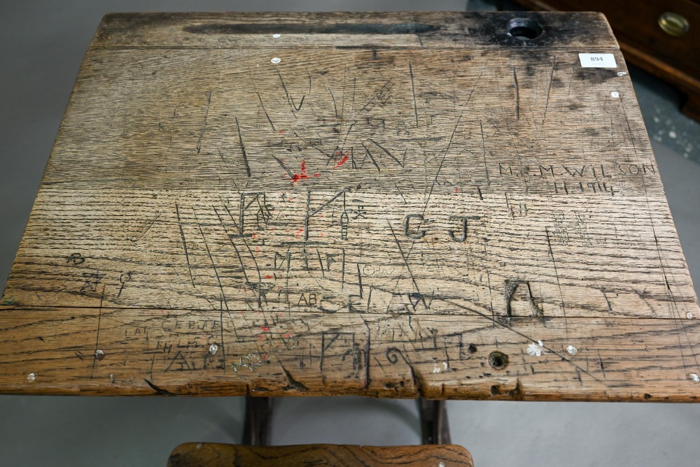 A Victorian cast iron and oak student/school desk, the slope top carved with multiple graffiti, - Image 4 of 7