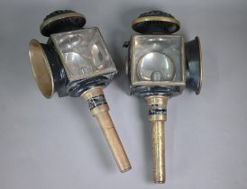 A pair of antique copper and tin coach lamps with candle fittings, by Heath & Sons of Farnham, 48 cm