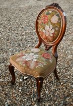 A Victorian walnut framed bed and tapestry upholstered chair