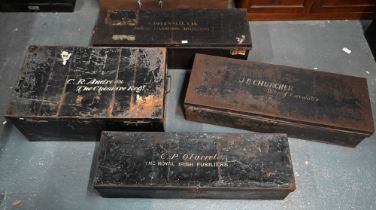 Four assorted antique japanned steel military uniform trunks, variously labelled A. Greenwell