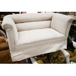 An Edwardian two seater sofa on tapering square supports and casters, cream linen fabric, 150 cm