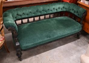 Late Victorian/Aesthetic settee, the ebonised spindled open frame with incised decoration and